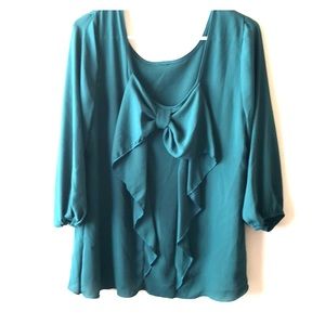 Emerald green bow blouse.